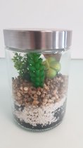 Kunstplant in glazen pot