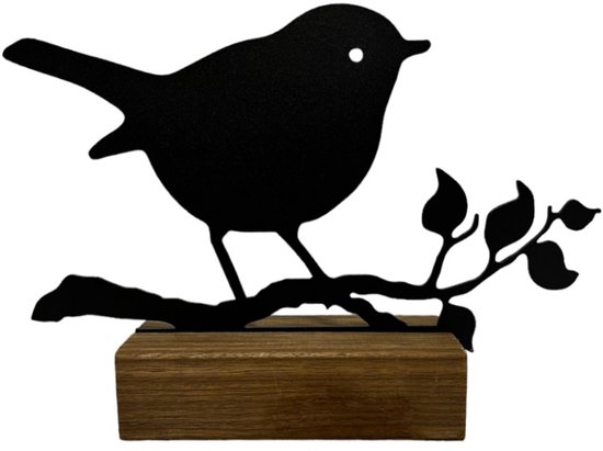 Zwarte metalen vogel op tak, met een houten blok als voet.