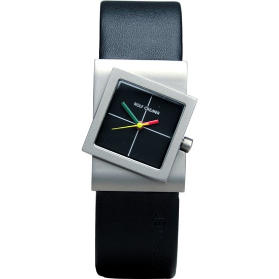 Rolf Cremer Turn horloge met zwart vierkant wijzerplaat, gekleurde wijzers en een zilveren kast op een zwarte band.