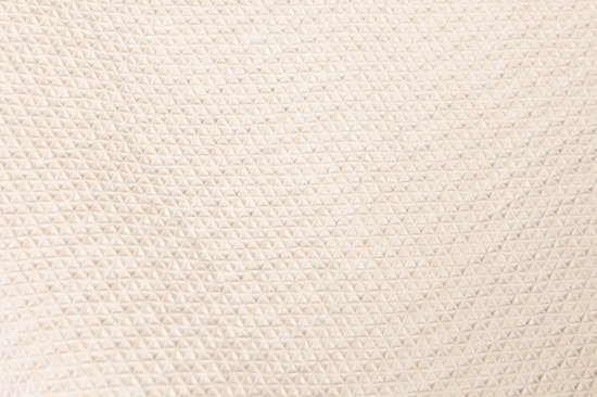 Beige textuur van kleine driehoekjes.