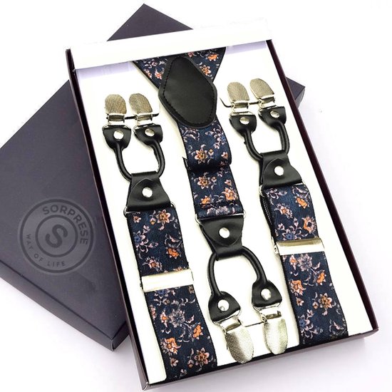 Bretels met blauw-oranje bloemenpatroon en zwarte leren details, gepresenteerd in een geschenkdoos.