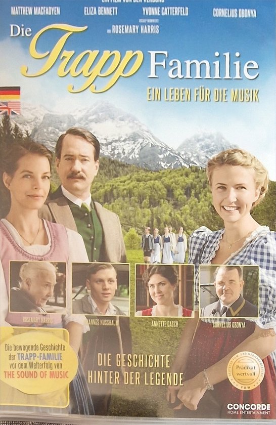 Voorkant dvd hoes van de film 'Die Trapp Familie - Ein Leben für die Musik'. Deel van de familie in traditionele kledij voor berglandschap.