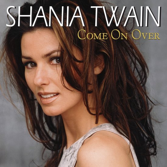 Shania Twain - "Come On Over". Zangeres met bruin haar, draagt zilveren top.
