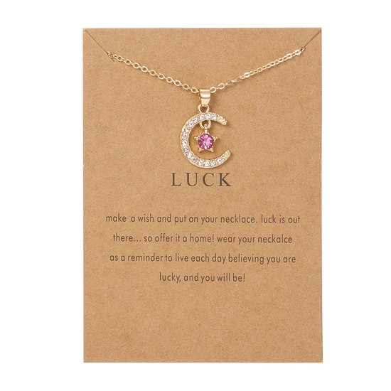 Gouden ketting met een maan en ster hanger, versierd met witte en roze zirkonia. Tekst 'LUCK' op de kaart.