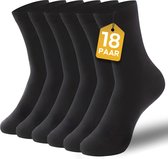 Zes paar zwarte sokken, met op de voorste sok een gele tag met '18 PAAR'.