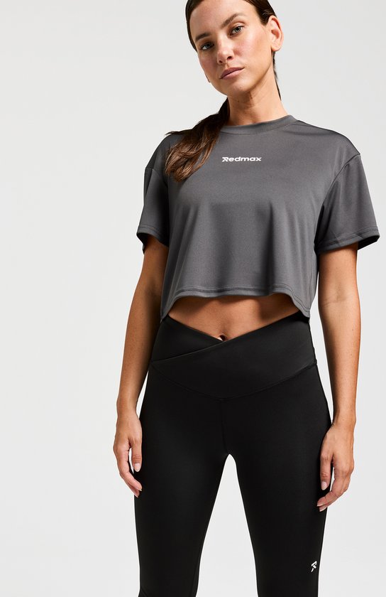 T-shirt court de sport gris foncé pour femme, manches courtes, avec le logo Redmax blanc sur la poitrine.