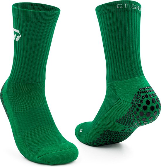 Chaussettes de sport vertes avec crampons noirs adhérents sur la semelle et le talon. Logo "GT GRIP" sur la tige.