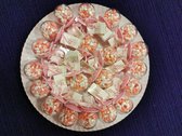20 bolle spenen roze gevuld met manna ,gepofte rijst, op een kartonnen schaal uitdeel-bedankje-traktatie