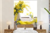 Behang - Fotobehang Acacia bloemen in potten in een woonkamer - Breedte 160 cm x hoogte 240 cm
