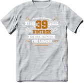 39 Jaar Legend T-Shirt | Goud - Wit | Grappig Verjaardag en Feest Cadeau Shirt | Dames - Heren - Unisex | Tshirt Kleding Kado | - Licht Grijs - Gemaleerd - L