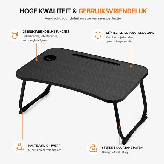 Zwarte bedtafel met bekerhouder en sleuf voor tablet/telefoon. Stevige poten en glad oppervlak.