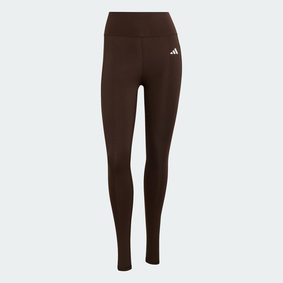 Donkerbruine dameslegging met wit Adidas logo op linkerbeen, staand model.