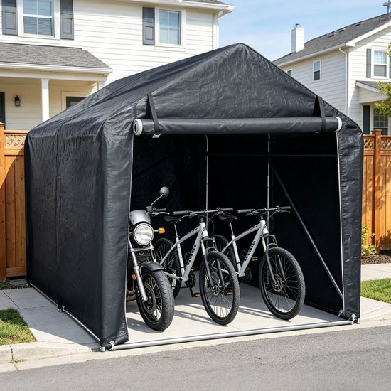 Grijze garagetent met motorfiets en twee fietsen erin, staand op een oprit.