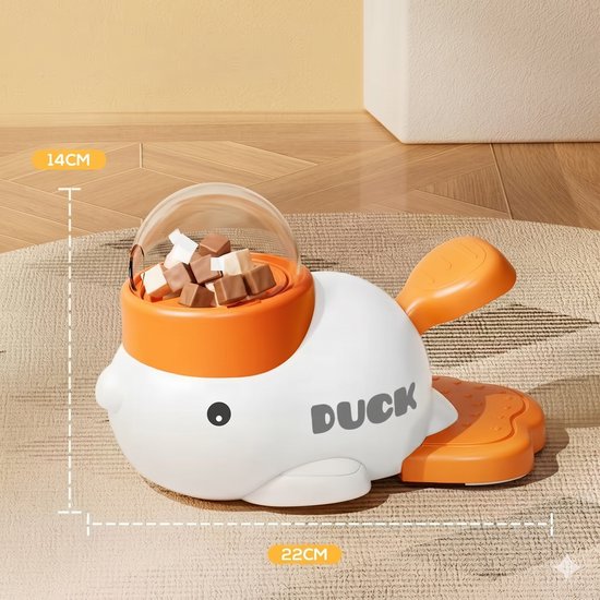Wit eendvormig snackdispenser met oranje accenten, gevuld met snoepjes. Afmetingen 22x14cm. Tekst 'DUCK' op de zijkant.