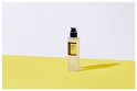 Fles COSRX Advanced Snail 96 Mucin Power Essence op een gele ondergrond met witte achtergrond.