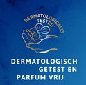 Gouden logo van TENA: hand met bloem. 'Dermatologisch getest en parfum vrij'.