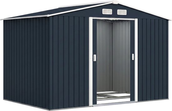 Donkerblauwe schuur met witte accenten en open schuifdeuren.