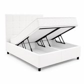Wit gestoffeerd bed waarvan de matras omhoog is geklapt, met zichtbare opbergvakken en ondersteuningsarmen.