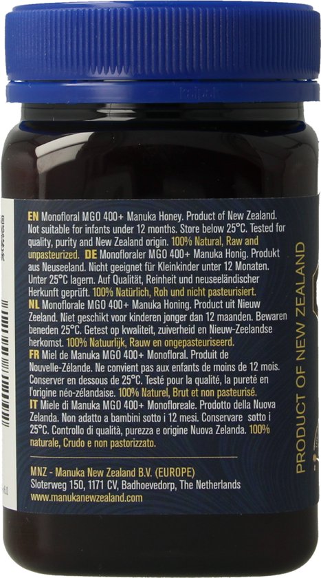 Achterkant pot Manuka Honing met blauw deksel. Meertalige tekst en productinformatie.