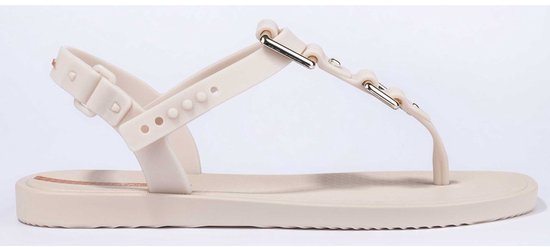 Lichtbeige Ipanema slipper met een enkelbandje en een band over de wreef met gouden gespen.