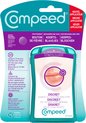 Een verpakking Compeed koortslip pleisters met applicator. De verpakking is turquoise en paars met een afbeelding van lippen en een pleister.