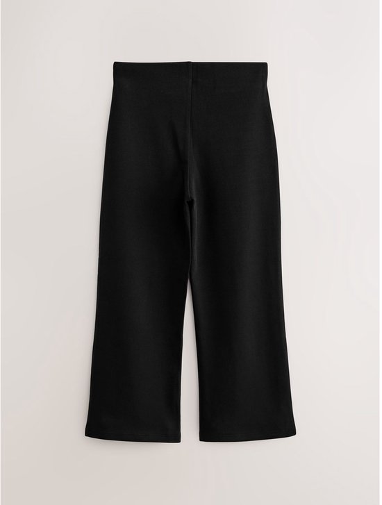 Zwarte, flared broek met elastische tailleband.