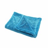 Turquoise microvezeldoek, deels gevouwen.