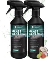 Twee zwarte spuitflessen Velorest Glasreiniger met fruit en waterdruppels.