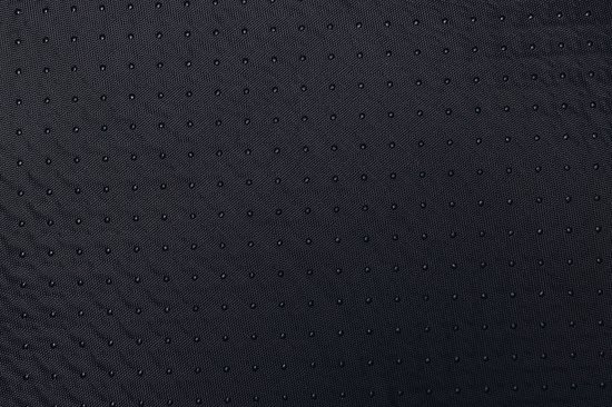 Donkergrijs anti-slip materiaal met vele kleine zwarte nopjes.