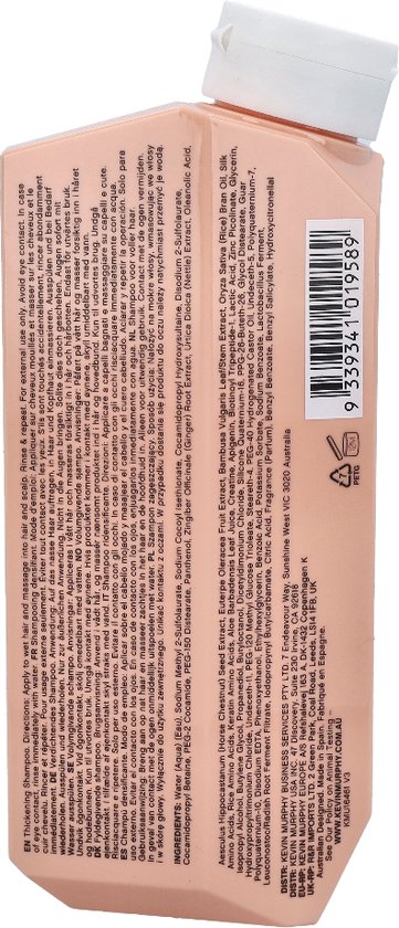 Achterkant van de perzikkleurige fles KEVIN.MURPHY PLUMPING.WASH shampoo met ingrediëntenlijst.