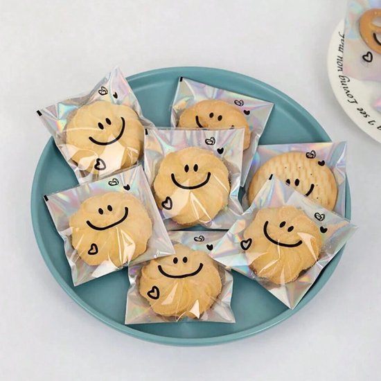 Smiley Uitdeelzakjes - 50 stuks - Iriserend - Uitdeelcadeaus - Traktatie voor kinderen - Transparant cellofaanzakjes