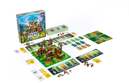Een LEGO Monkey Palace bordspel met doos, bruine, oranje en beige toren, kaarten en speelmat.