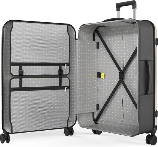 Valise Rollink beige clair ouverte avec intérieur gris, pois jaunes, sangles croisées et compartiments.