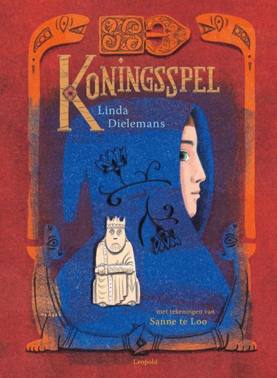 Boekomslag met de titel 'Koningsspel'. De illustratie toont een blauwe, met patronen versierde doek met een profiel van een vrouw. Een schaakstuk van een koning is zichtbaar.
