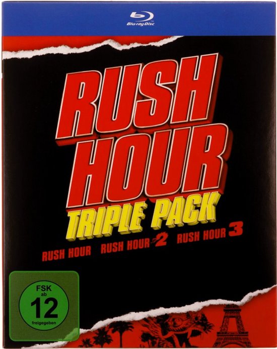 Blu-ray hoes met rode en zwarte scheuren. Grote rode tekst 'RUSH HOUR' boven gele tekst 'TRIPLE PACK'. Toont 'RUSH HOUR', 'RUSH HOUR 2', 'RUSH HOUR 3' onderaan. Groen FSK 12-logo links.