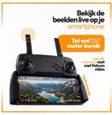 Zwarte drone controller met telefoonhouder met live beeld van een dronevlucht. Tot 250 meter bereik.