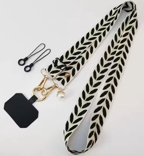 Cordon de téléphone avec motif de feuilles noir et blanc, fermoir mousqueton doré et breloque perle.