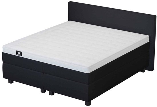 Zwarte boxspring met een wit matras en een zwart hoofdbord. Matras met subtiel ruitpatroon.