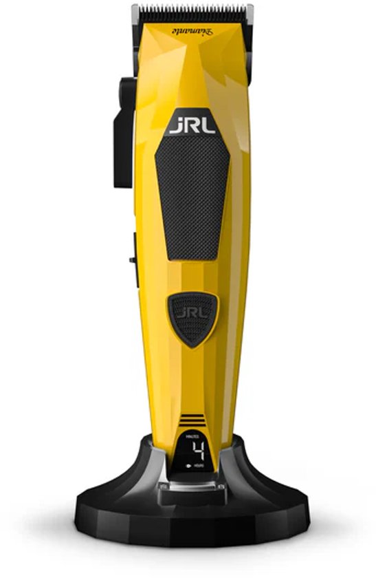 Gele JRL Diamante tondeuse met zwarte grip, op zwarte oplader.