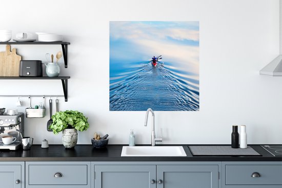 Un homme rame dans une affiche de bateau à rames rouge 75x75 cm - Tirage photo sur Poster (décoration murale salon / chambre) / Affiche de Sport