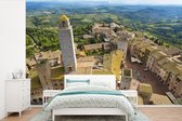 Behang - Fotobehang San Gimignano van bovenaf bij Toscanië in Italië - Breedte 330 cm x hoogte 220 cm