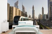Behang - Fotobehang Een trein in de stad Dubai - Breedte 330 cm x hoogte 220 cm