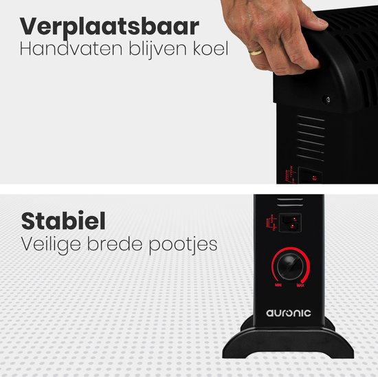 Een hand wordt getoond die de draaghendel van de zwarte convector kachel vastpakt. De kachel heeft brede, stabiele pootjes.