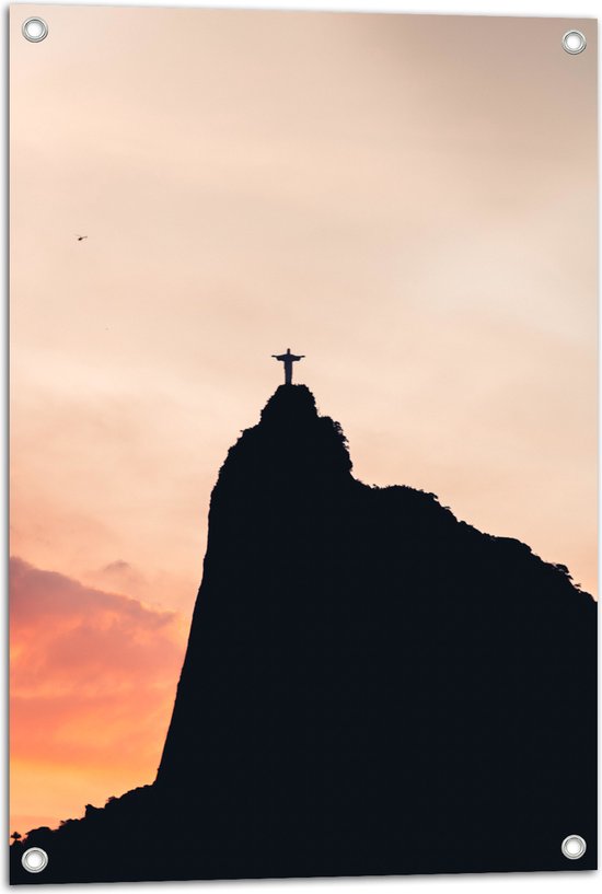 WallClassics - Tuinposter – Silhouet van Jezusbeeld op berg met Zonsondergang - 50x75 cm Foto op Tuinposter  (wanddecoratie voor buiten en binnen)