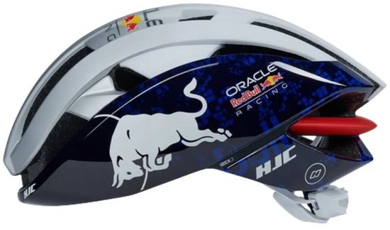 Zij aanzicht van een witte fietshelm met Red Bull Racing logo, witte stier op blauw patroon.