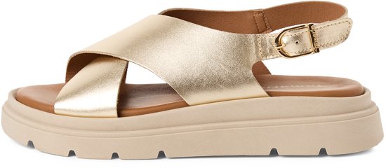 Sandales dorées Tamaris avec brides croisées, boucle à la cheville et semelle épaisse.