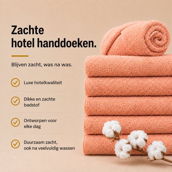 Stapel zalmroze handdoeken met takje katoen. Tekst: Zachte hotel handdoeken, luxe kwaliteit, dikke badstof.