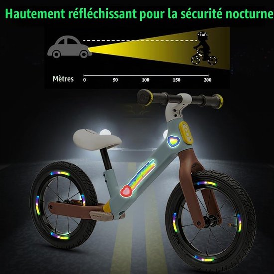 Loopfiets met reflecterende stickers. Tekst: 'Haute réflexion pour la sécurité nocturne' met zichtbaarheidsschema.