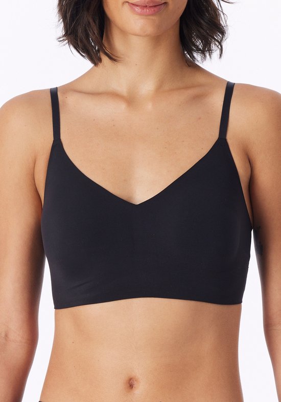 Zwarte, onzichtbare bustier van Schiesser met V-hals en dunne bandjes. De bustier is op een vrouw te zien.