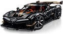 Zwarte Koenigsegg speelgoedauto met oranje interieur, gouden accenten en grote achterspoiler.